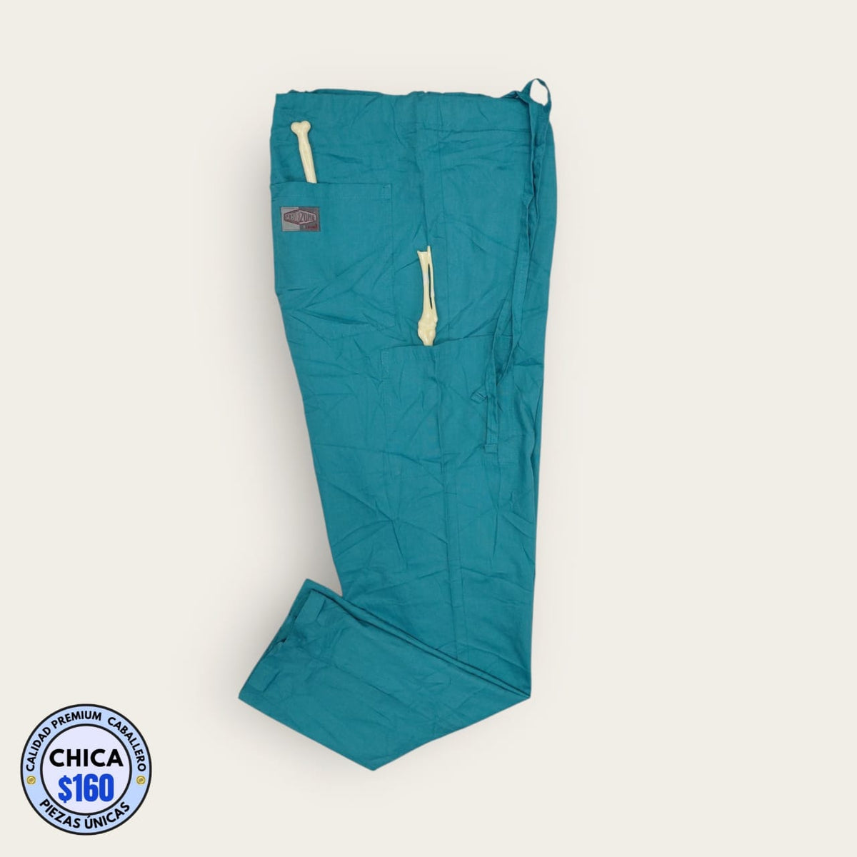 Pantalón médico ScrubZone turquesa, talla chica para caballero, línea Premium de Uniformes MID.